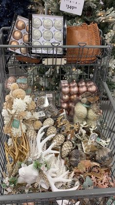 a shopping cart filled with lots of christmas decorations