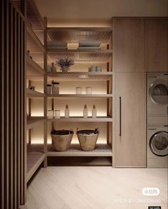 a washer and dryer in a room with wooden shelves