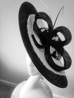 This is a gorgeous wide brim hat handcrafted with sinamay, mat and cord lace. This is a must have for mothers of bride/groom for that special day, it is also ideal for Derby, Royal ascot, wedding guest and all your special occasions. We don't repeat our designs, please get this before it's gone. It comes in black/ivory and red/ivory. Elegant Handmade Flat Brim Straw Hat, Elegant Handmade Wide Brim Sun Hat, Elegant Handmade Adjustable Straw Hat, Adjustable Sinamay Straw Hat For Royal Ascot, Elegant Handmade Boater Hat With Flat Brim, Handmade Elegant Boater Hat With Flat Brim, Elegant Beach Fascinator With Adjustable Fit, Handmade Elegant Flat Brim Boater Hat, Elegant Handmade Brimmed Hat