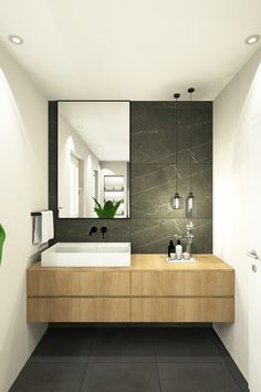 a bathroom with two sinks and a large mirror