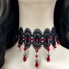 Dear customers, for a price offer of expedited shipping outside of Germany, please contact me directly via Etsy messages. One of a kind gothic lace beaded choker and earrings, made with black lace a dark red satin ribbon, with hand sewn deep red Swarovski beads and teardrops, the perfect decoration for a gothic queens neck. Goth fashion is distinguished by darkness, mystery, elegant wardrobe pieces and, smoky makeup even though it may surprise some that not all Goths always wear black. It's said Red Gothic Jewelry For Party, Red Punk Choker As Gift, Handmade Gothic Choker As Gift, Handmade Gothic Choker Gift, Handmade Gothic Choker For Gift, Adjustable Halloween Choker Gift, Black Vampire Jewelry For Festival, Vampire Style Black Jewelry For Festivals, Black Choker For Halloween Gift