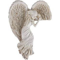 an angel figurine is shown on a white background