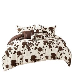 a brown and white cow print comforter set