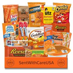 an orange box filled with lots of different types of snacks and candy bars on top of each other