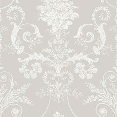 a white wallpaper with an ornate design on it