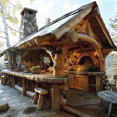 an outdoor kitchen made out of logs