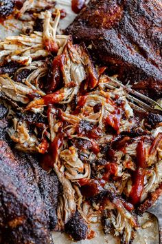 barbecue ribs with bbq sauce on the side, and two forks in front of them