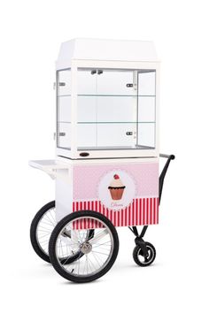 an ice cream cart with wheels and a cupcake on the front, sitting against a white background