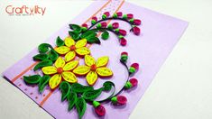 a card with flowers and leaves on it