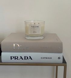 a candle sitting on top of two books