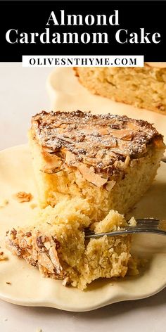 a piece of almond cardamom cake on a plate with a fork in it