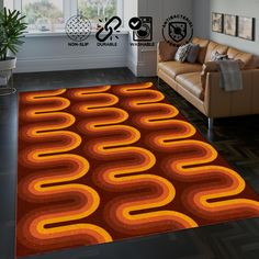 a living room area rug with an orange and yellow design