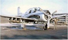 an airplane is parked on the tarmac with two men standing next to it in front of it