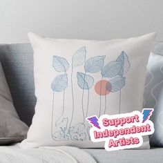 a pillow with the words support independent artists on it