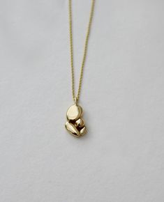 Minimalist 14k gold necklace - this is an abstract solid gold pendant necklace. This modern necklace is an originalhandmade solid gold jewelry piece that will upgrade every outfit with a unique touch.  "Mama's hug" necklace is a peaceful and meaningful pendant that holds those emotions of a mother's hug, love & security I've been back and forth working on this pendant for nearly two years, knowing that this would be a meaningful necklace to wear for life. And it turned out to be my favorite piec Gold Pendant Necklace Unique, Minimalist 14k Gold Pendant Necklace, Minimalist Recycled Gold Pendant Necklace, Minimalist Yellow Gold Brass Necklace, Modern 14k Gold Pendant Necklace, Minimalist Recycled Gold Necklace In Gold, Gold Minimalist Recycled Gold Necklace, Minimalist Yellow Gold Necklace In Recycled Gold, Modern Yellow Gold Necklace In Recycled Gold