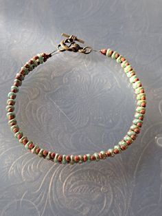 This is green and brown beaded bracelet is made from superduo and seed glass beads. It measures 8 inches in diameter. Black Drawing Salve, Organic Dry Shampoo, Drawing Salve, Czech Glass Bead Bracelet, Super Duo Beads, Duo Beads, Seeded Glass, Glass Beaded Bracelets, Seed Bead Bracelets