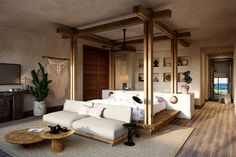 a living room filled with furniture and a flat screen tv on top of a wooden table