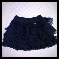 Gilly Hicks Dark Blue Mini Ruffle Skirt. Never Worn. Please Refer To Pictures For Measurements. Elegant Blue Ruffled Mini Skirt, Blue Mini Skirt With Ruffles, Blue Ruffled Skort, Dark Blue Mini Skirt, Blue Ruffled Mini Skirt, Blue Ruffle Skirt, Mini Ruffle Skirt, Denim Blue Ruffled Mini Skirt, Dark Blue Skirt