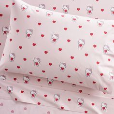 two pillow cases with hello kitty hearts on them and one has a red heart in the middle