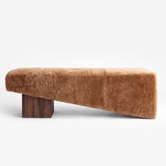 a bench made out of wood and fur