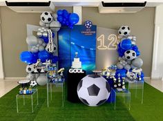 a soccer themed birthday party with balloons and decorations