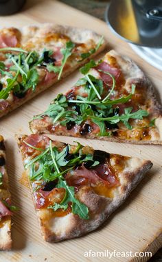 several slices of pizza on a wooden cutting board