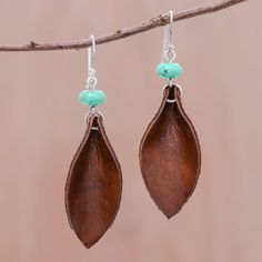 Handcrafted from brown leather two leaves dangle below beads of reconstituted turquoise. Chaloemphon presents these Thai earrings which are crafted with sterling silver. Hoop Earrings Diy, Handmade Leather Jewelry, Beaded Jewelry Earrings, Diy Leather Earrings, Leather Jewelry Diy, Beaded Chandelier Earrings, Beaded Earrings Diy, Jewelry Making Earrings, Beaded Earrings Patterns