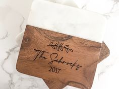 a wooden cutting board with the words, the salvations written on it