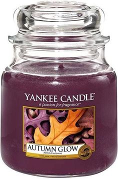 an autumn glow yankee candle in a glass jar