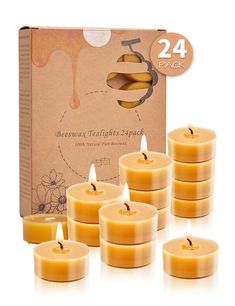 twelve beeswax candles are shown in front of a box with each candle lit