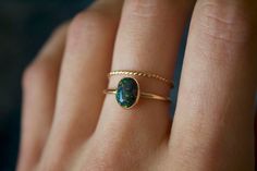 Handmade 8x6mm oval black opal ring✨  * Listing covers both the opal ring and twisted band. Dainty and perfect minimalist piece!  Stunning 8x6mm lab grown Kyocera opal gemstones. Each stone is hand set into a bezel and polished for a beautiful shine finish.   Opal means jewel. The energies of this stone will also encourage you to express your true self, in addition to feeling confident and comfortable in your own skin, and this will radiate in your words, thoughts, and actions. * Please note photos are zoomed in up close, therefore the size of the stone may appear slightly larger in photos. Model is wearing a size US 5.5. Please refer to stone measurement to best determine the size & look you're looking for.  Material: 14/20 (karat/purity) gold filled metal OR 925 Sterling silver / 935 arg Black Opal Jewelry, Opal Solitaire Ring, Black Opal Ring, Opal Ring Gold, Feeling Confident, Twisted Band, Argentium Silver, Opal Ring, Black Opal