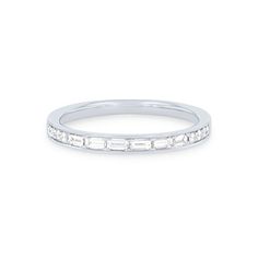 a white gold wedding band with baguettes set in the middle and diamonds on each side