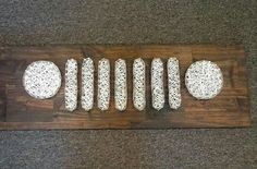 some bread is sitting on top of a wooden board with white crochet designs