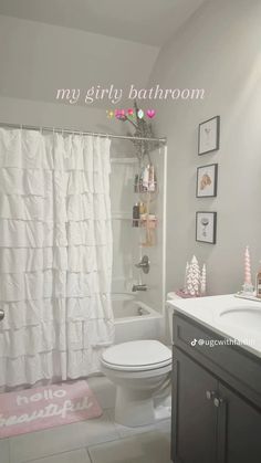 a bathroom with a shower, toilet and sink