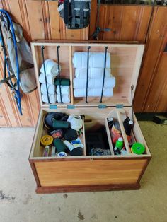 a wooden box filled with lots of different items