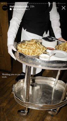 a woman holding a tray with food on it