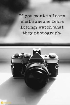 a camera sitting on top of a window sill next to a quote that reads, if