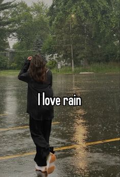 a woman walking in the rain with an umbrella over her head and text that reads, i love rain