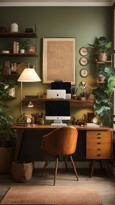 a desk with a computer on top of it next to a potted plant and lamp