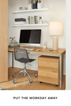 a desk with a computer on top of it