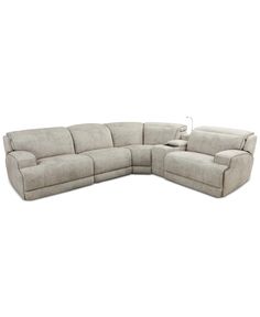 a large sectional couch sitting on top of a white floor