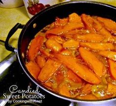 carrots are cooked in a pan on top of the stovetop and ready to be eaten