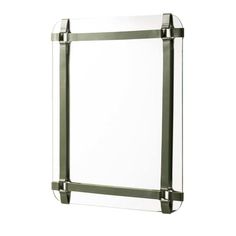 a mirror that is on the wall with some metal bars around it's edges