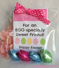 an egg - specially sweet friend is packaged in cellophane with pink and green eggs