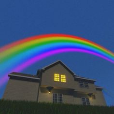 a house with a rainbow coming out of the window and grass in front of it