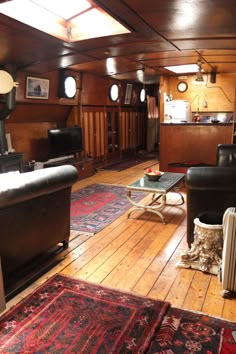 a living room filled with furniture and lots of wood