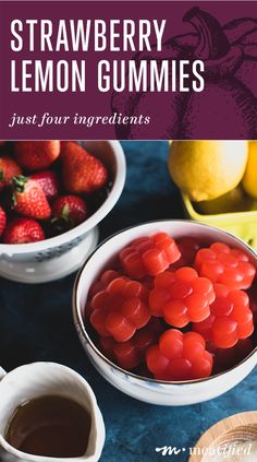 strawberries and lemons in bowls next to fruit