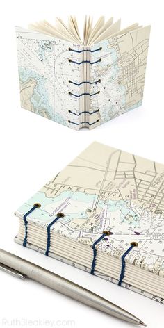 an open notebook with a map on it and a pen next to the book cover