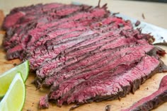 a large piece of meat sitting on top of a wooden cutting board