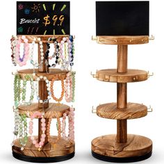 two wooden jewelry racks with necklaces on them and a chalkboard sign in the background